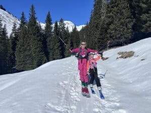 Family enjoying freeriding on snowy mountain slopes at Arlberg.